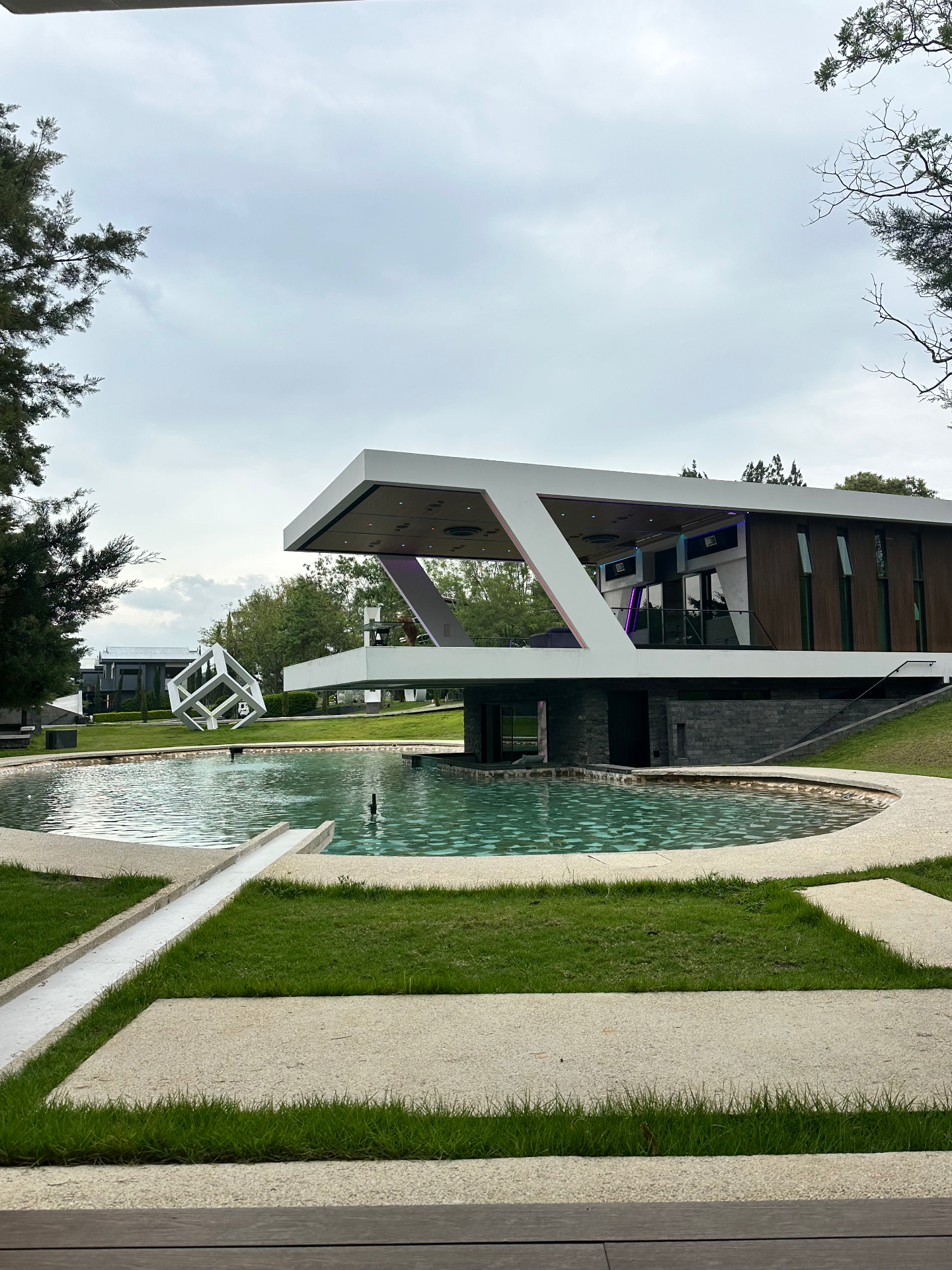 Modernist cantilevered pavilion above a reflecting pool — Punta Leona